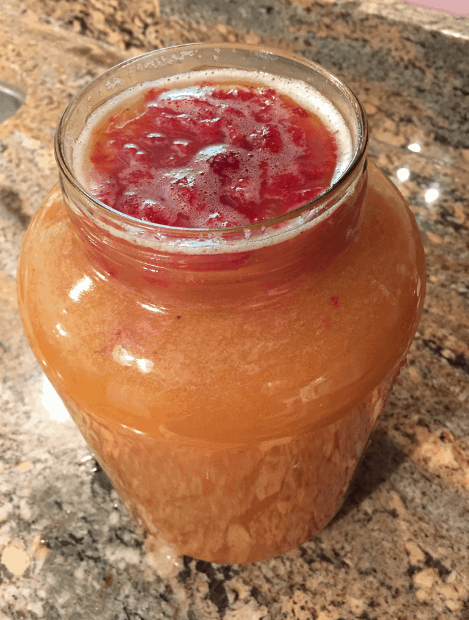 Strawberry Slush Cocktail in a large glass jar.