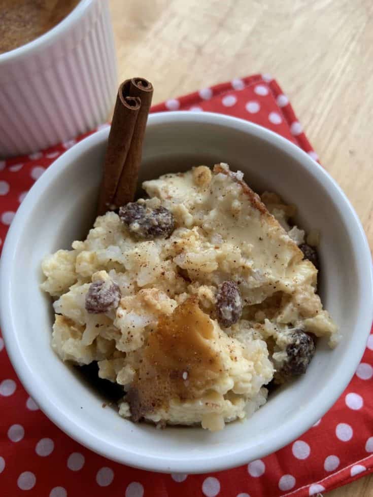 Rice Pudding in a bowl with a cinnamon stick
