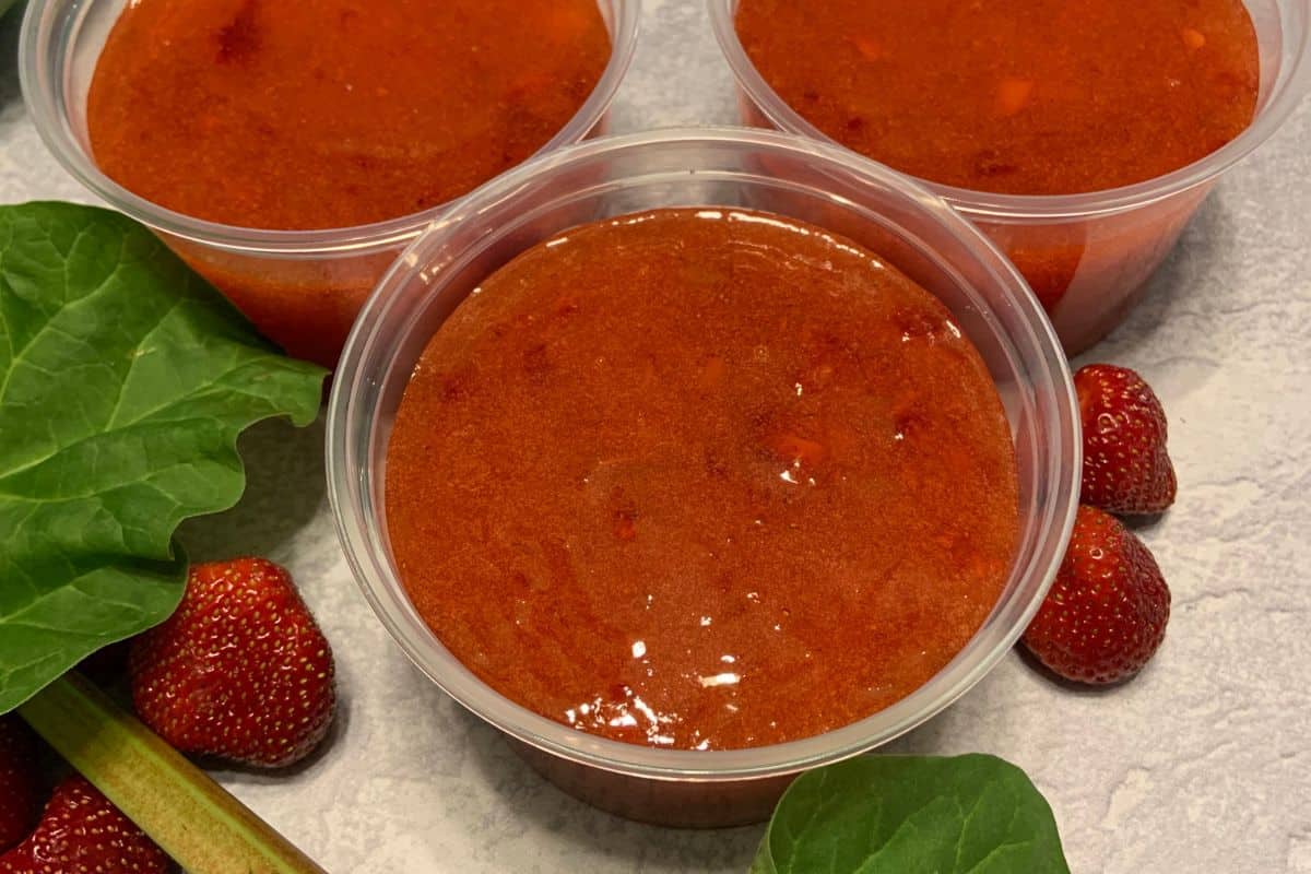 Homemade Strawberry Rhubarb Jam Recipe in Plastic Freezer Containers.