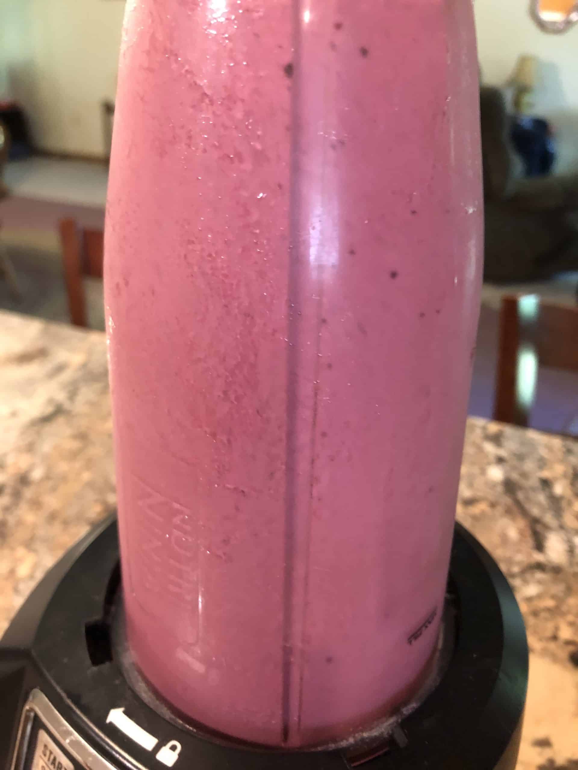 Blended Strawberry Blueberry Smoothie in blender cup