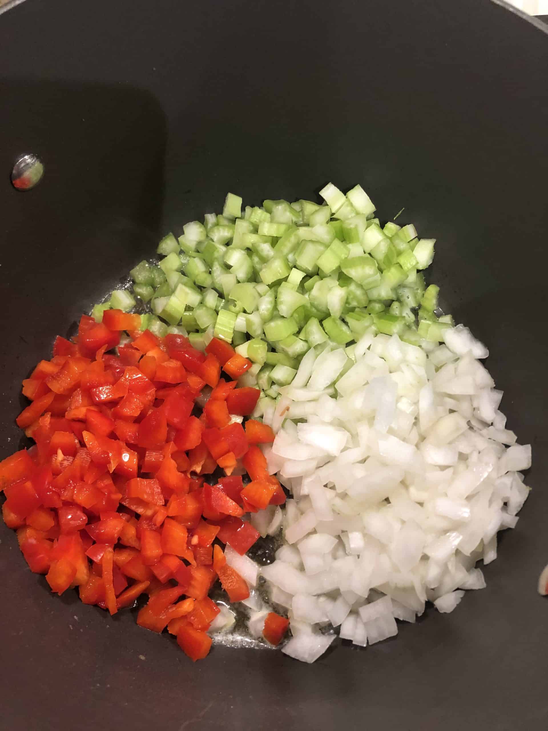 Diced Celery, Onions and Red Peppers in a Sauce Pan