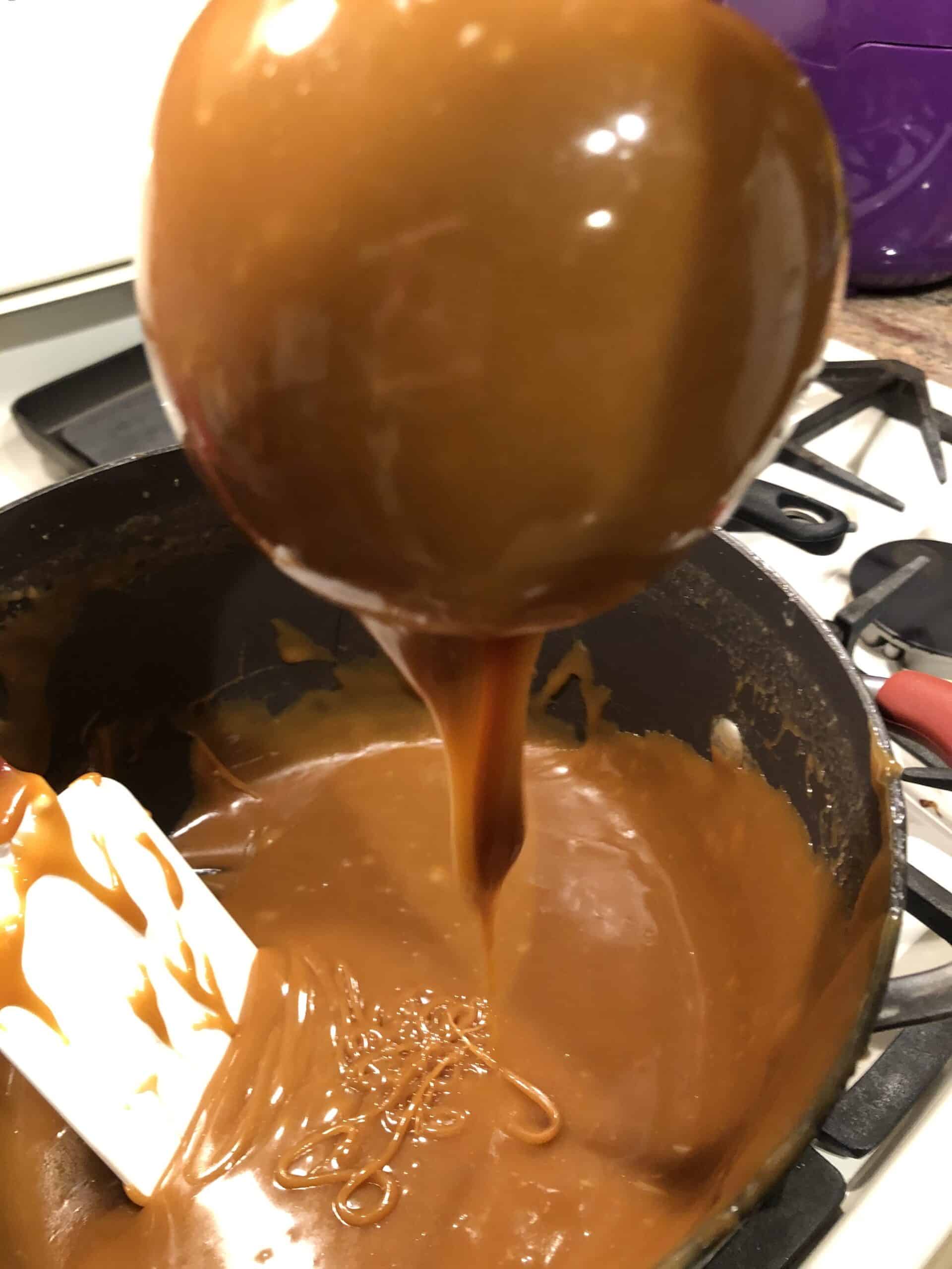 Dipped Caramel Apple - let excess caramel drip from the bottom of the apple.