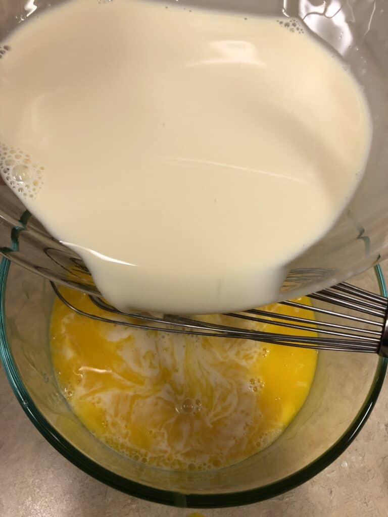 Combine Egg Yolks and Evaporated Milk