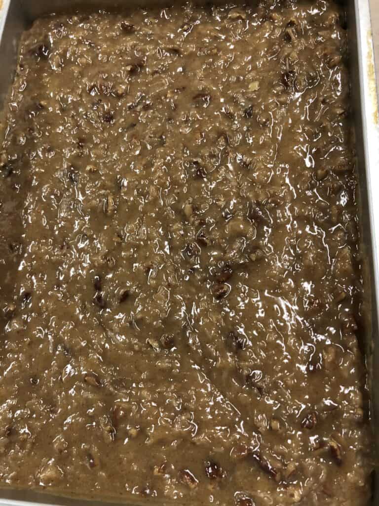 German Chocolate Frosting cooling in a 9x13 Baking Pan.