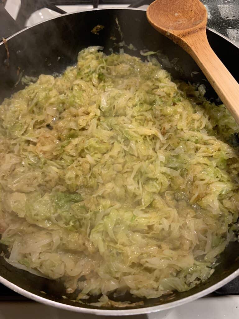 Cabbage pierogi filling in a saute pan.