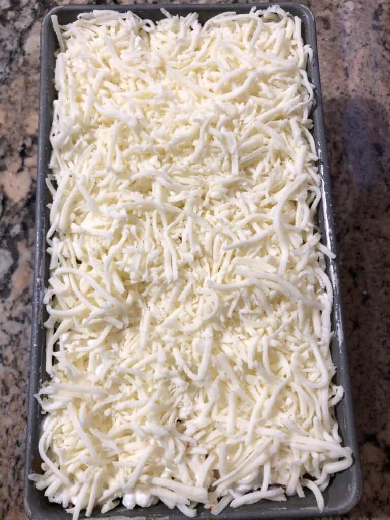 Full pan of unbaked homemade lasagna