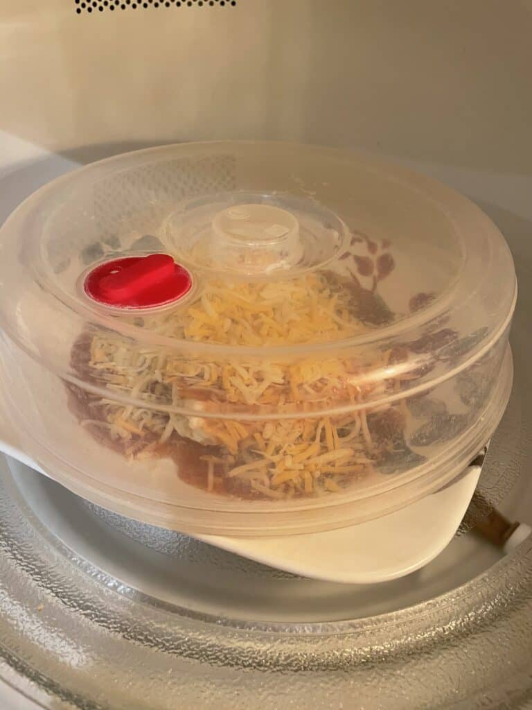 Covered wet burrito in microwave.