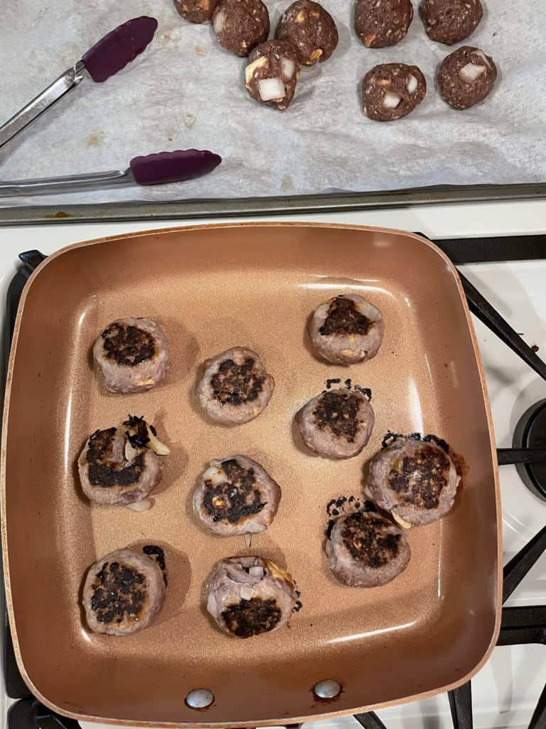 Sautéed Meatballs in a pan.
