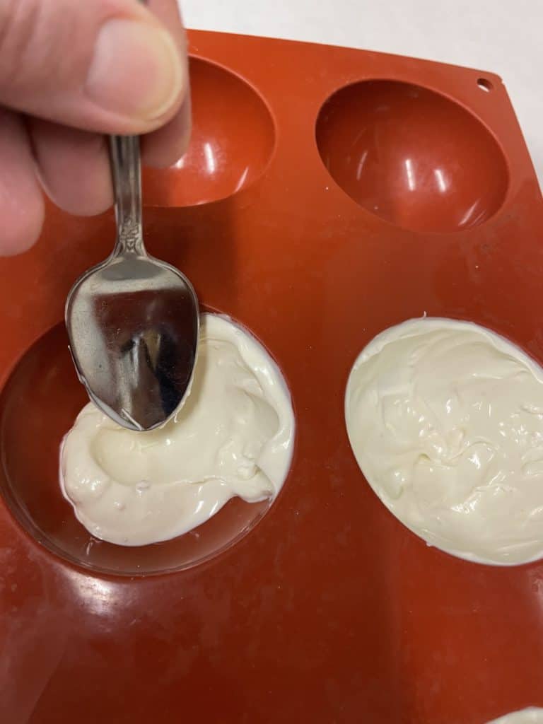 Use a Spoon to Coat the Sides of the Mold.