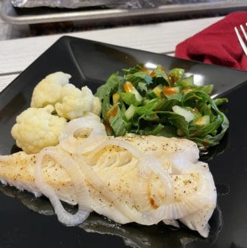Oven-Baked Walleye Recipe with steamed cauliflower and a side salad.