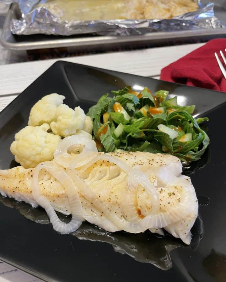 Oven-Baked Walleye Recipe with steamed cauliflower and a side salad.