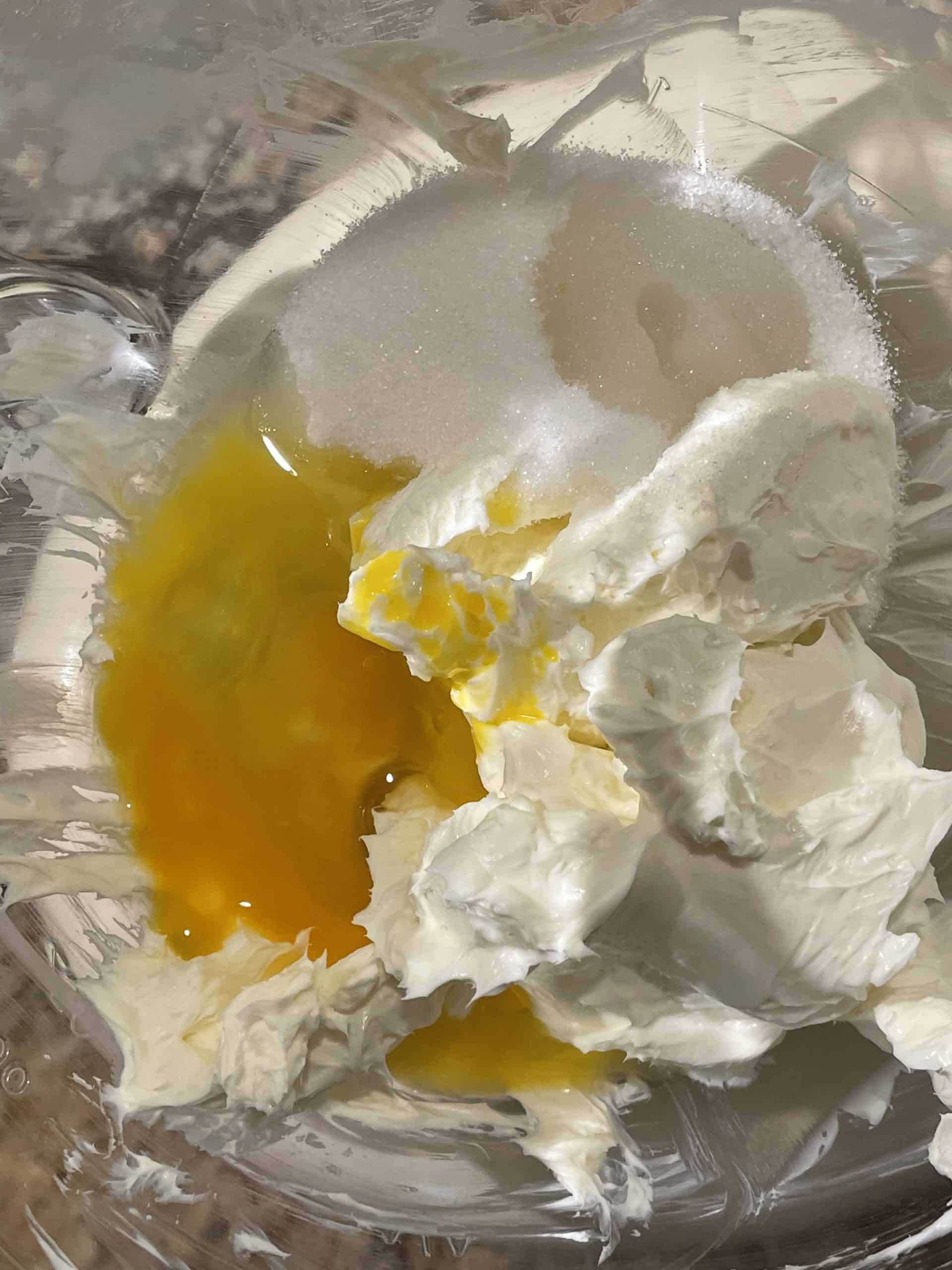 Add the egg, sugar and vanilla to the whipped cream cheese.