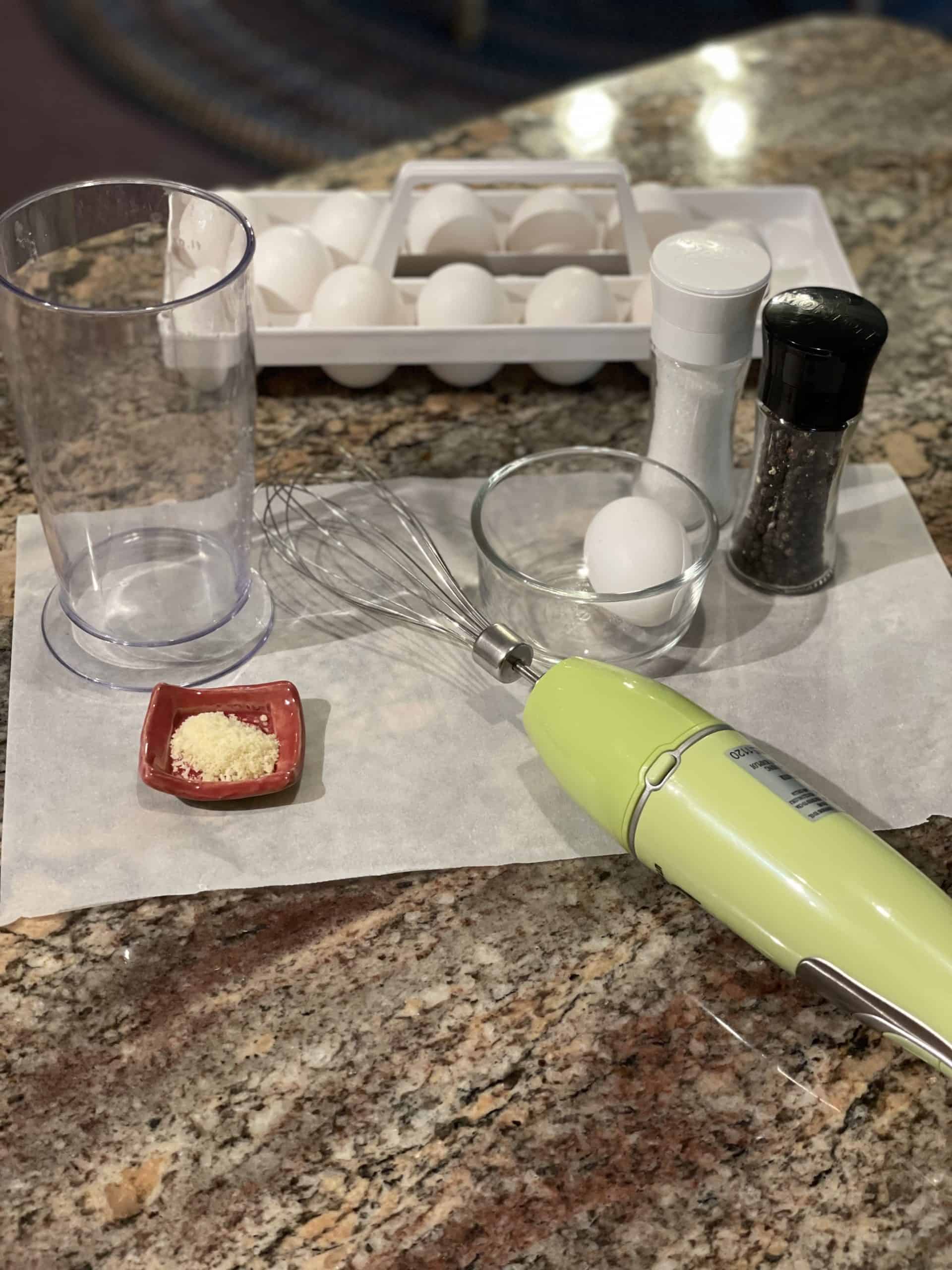 Cloud Egg Ingredients - Eggs, Parmesan Cheese, Salt and Pepper along with a hand mixer.