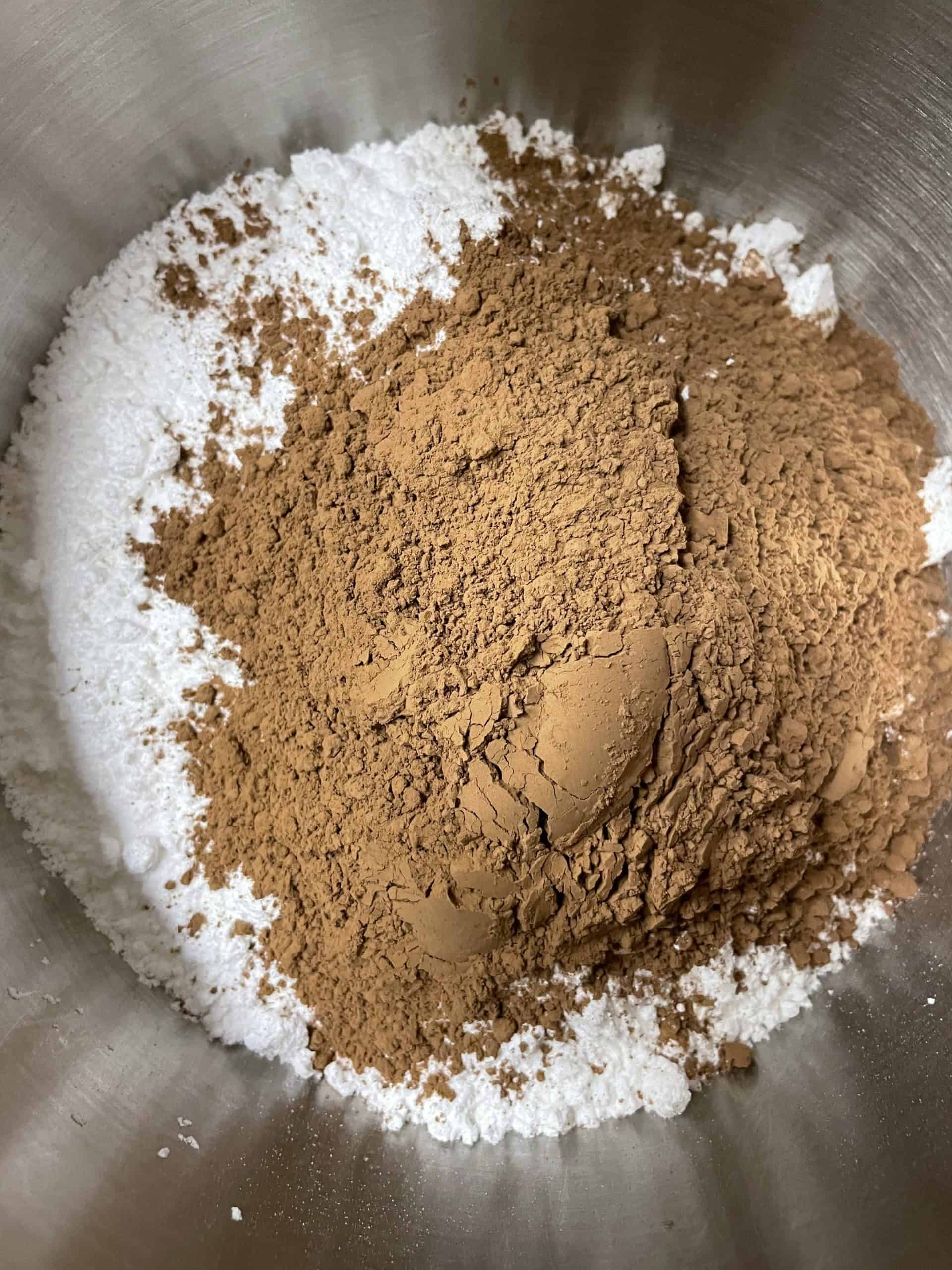Powdered sugar and cocoa powder in a mixing bowl.