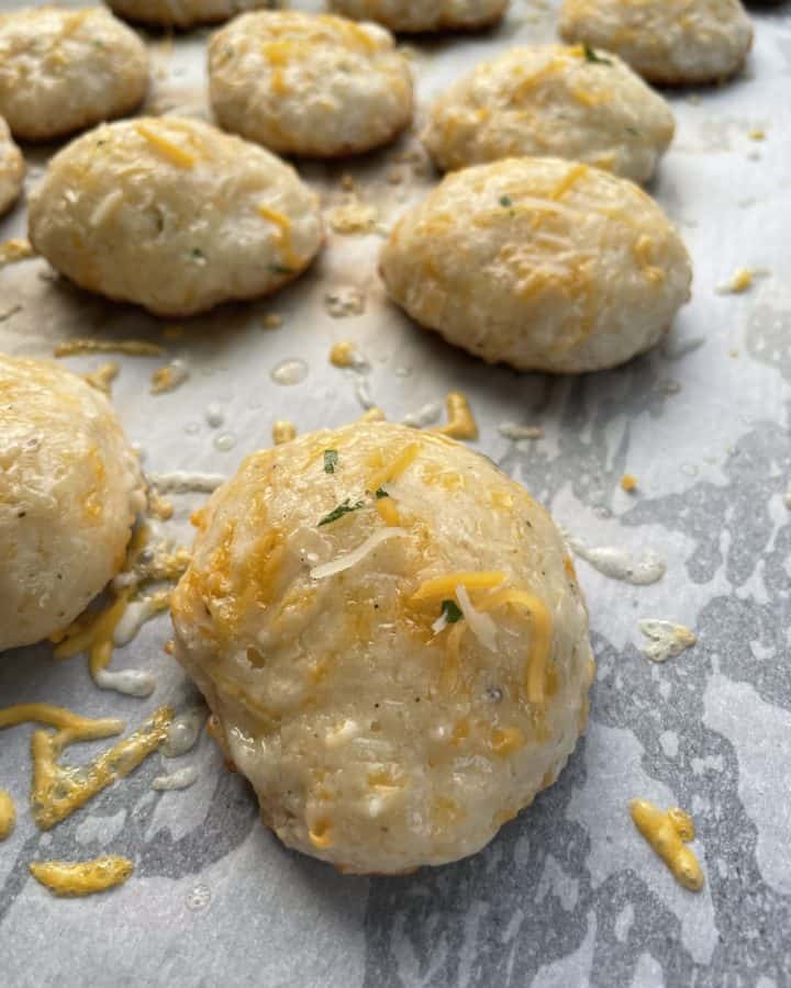 Cheddar Biscuits baked on a griddle.