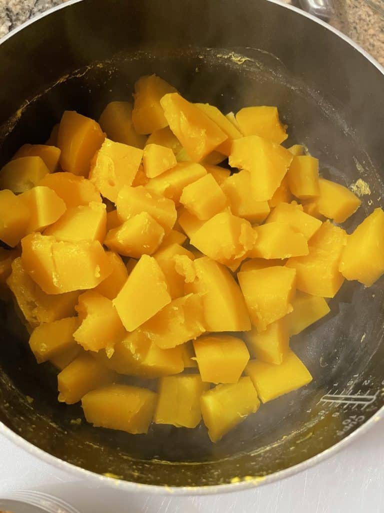 Drain the water off of the cooked squash.