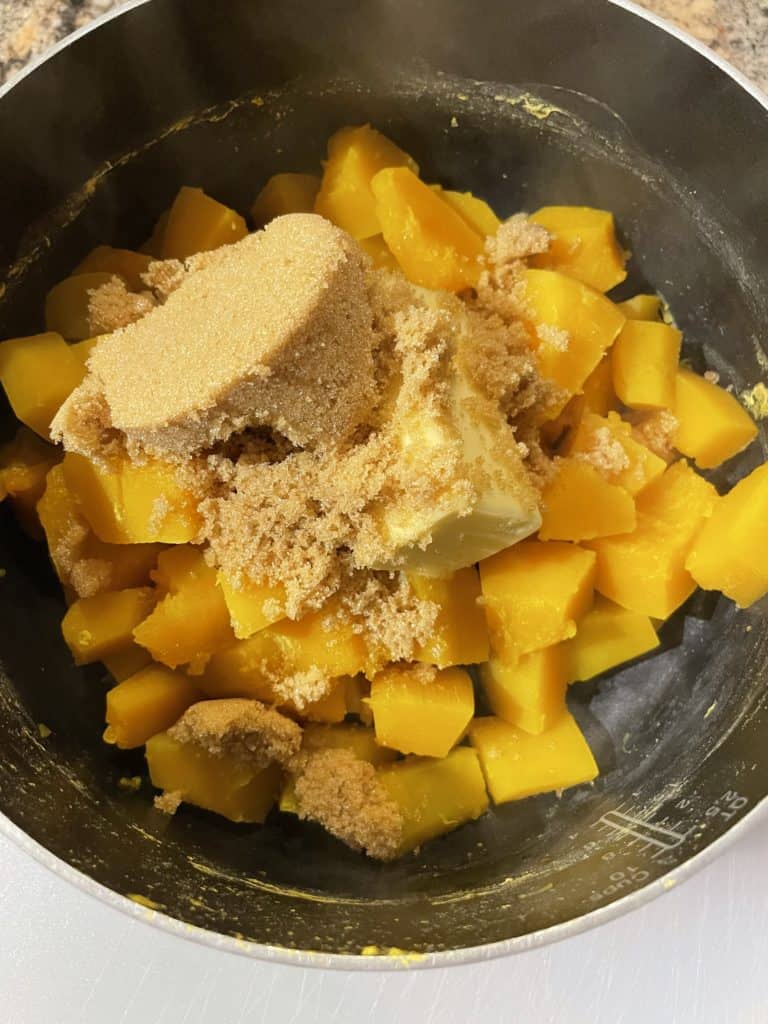 Cooked butternut squash with butter and brown sugar added.