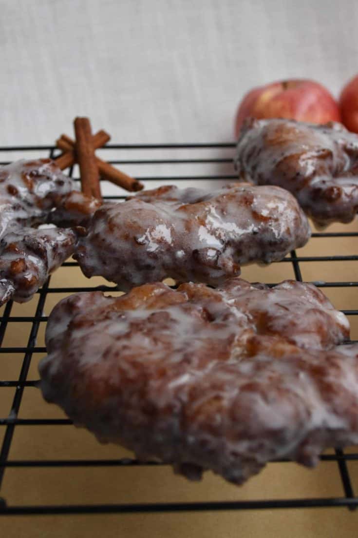 Apple Fritters Donut on a wire rack.