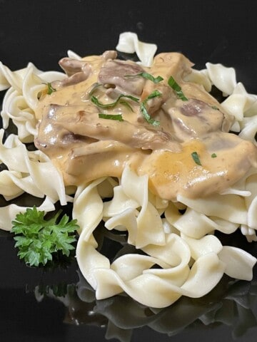 Lion's Mane Mushroom Cream Sauce with Beef on top of egg noodles.