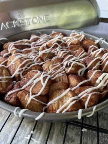 Blackstone Griddle Monkey Bread with Biscuits in a pan.