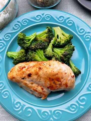Best Marinated Chicken Recipe on a plate with steamed Broccoli.