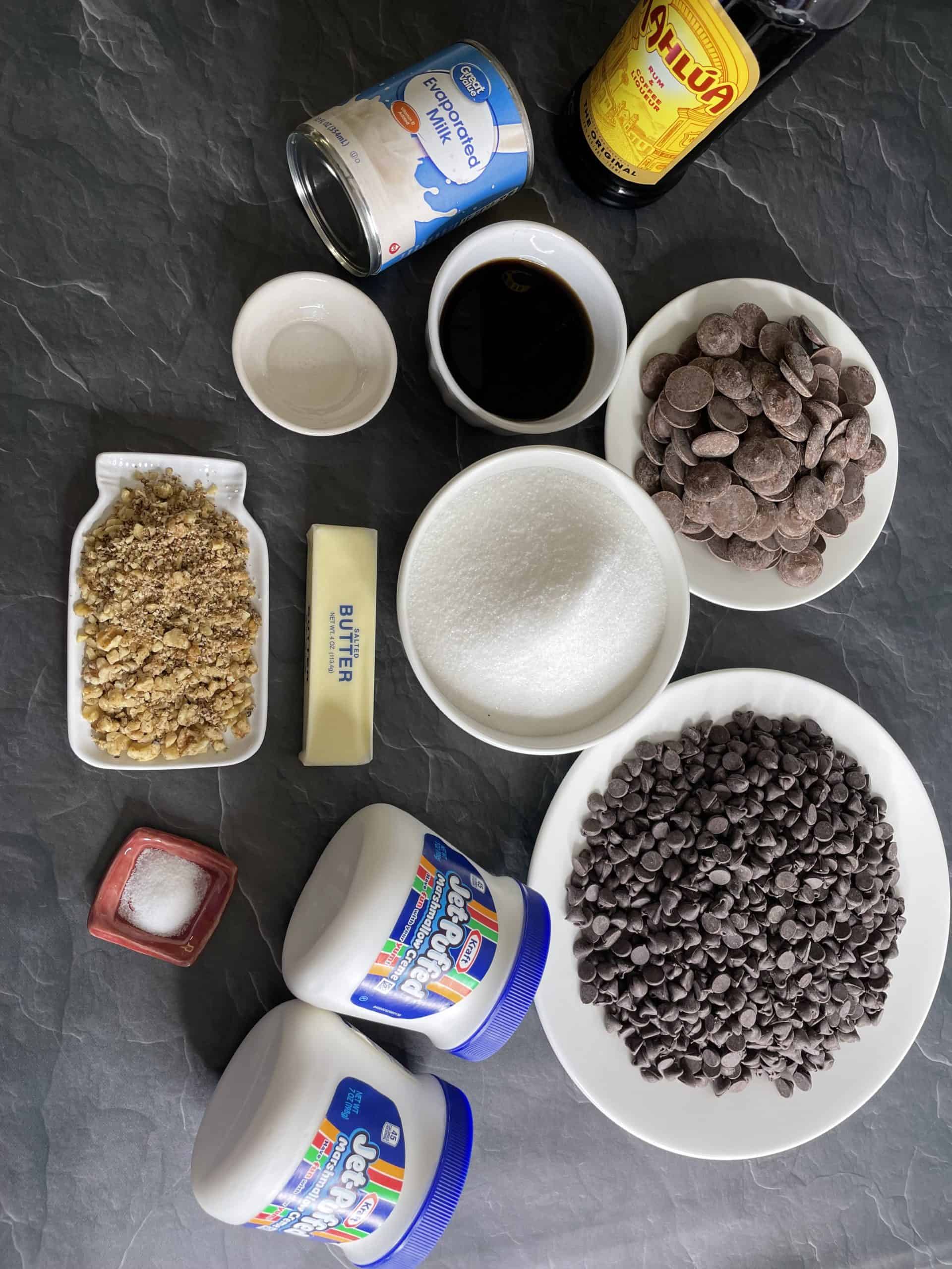 Chocolate Fudge Recipe Ingredients -Granulated Sugar, Marshmallow cream, Evaporated Milk, Salted Butter, Kahlua, Salt, Semi-Sweet Chocolate Chips, Milk Chocolate Chips, Chopped Walnuts, and Vanilla Extract. 