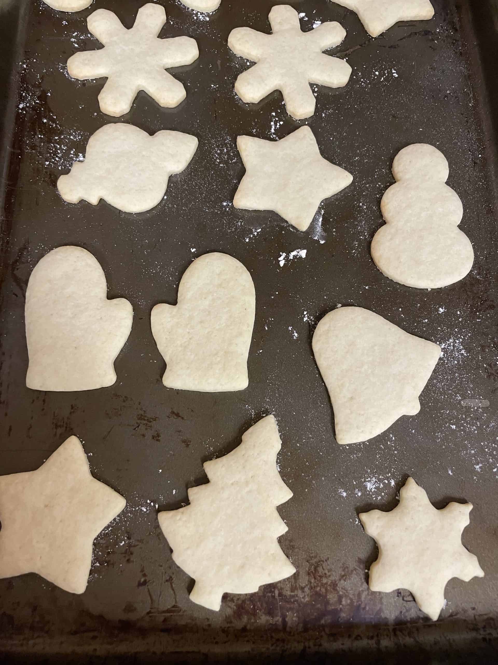 Baked cut out sugar cookies recipe on a sheet pan.