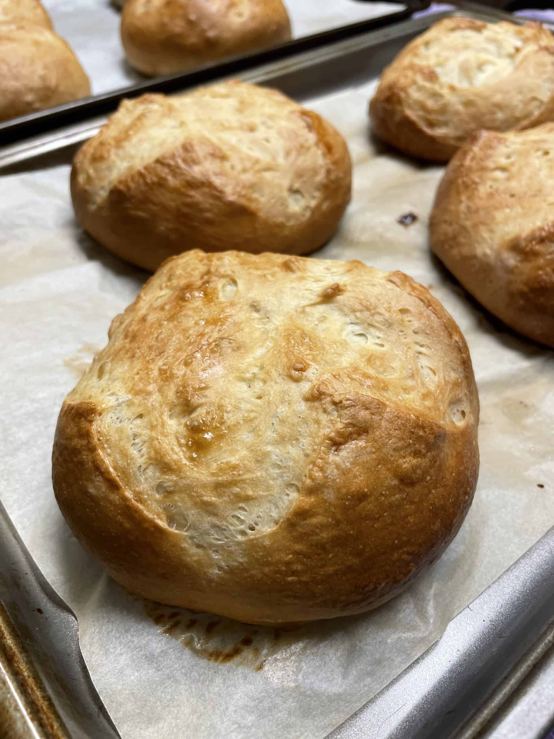 Fully Baked Homemade Bread Bowls Recipe on a Baking Sheet.