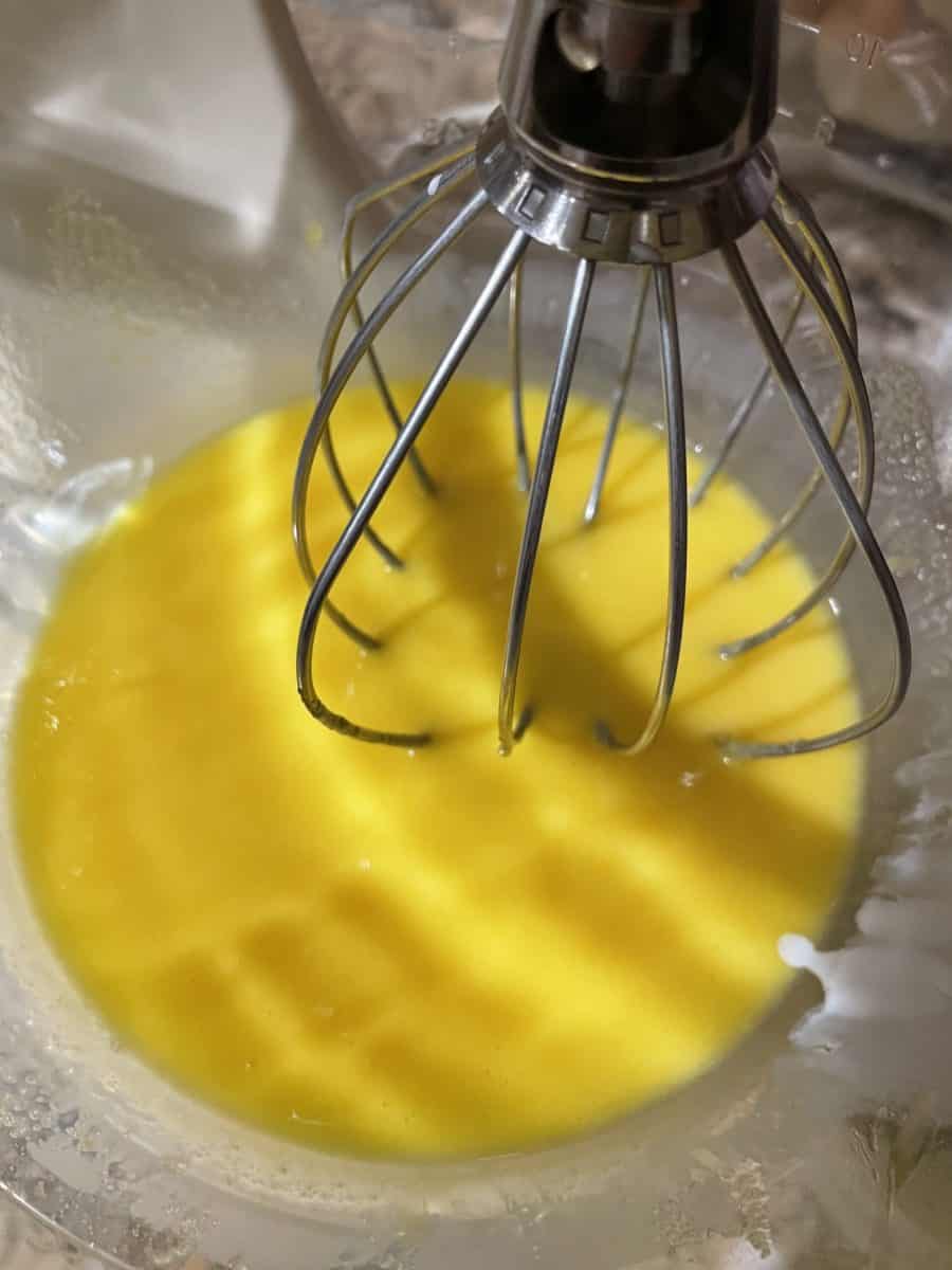 Custard mixture in a mixing bowl.