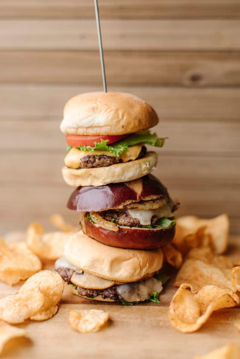 Smash Burger Tower Surrounded by Homemade Potato Chips.