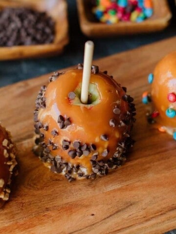 Caramel Apples Trio paired with toppings.