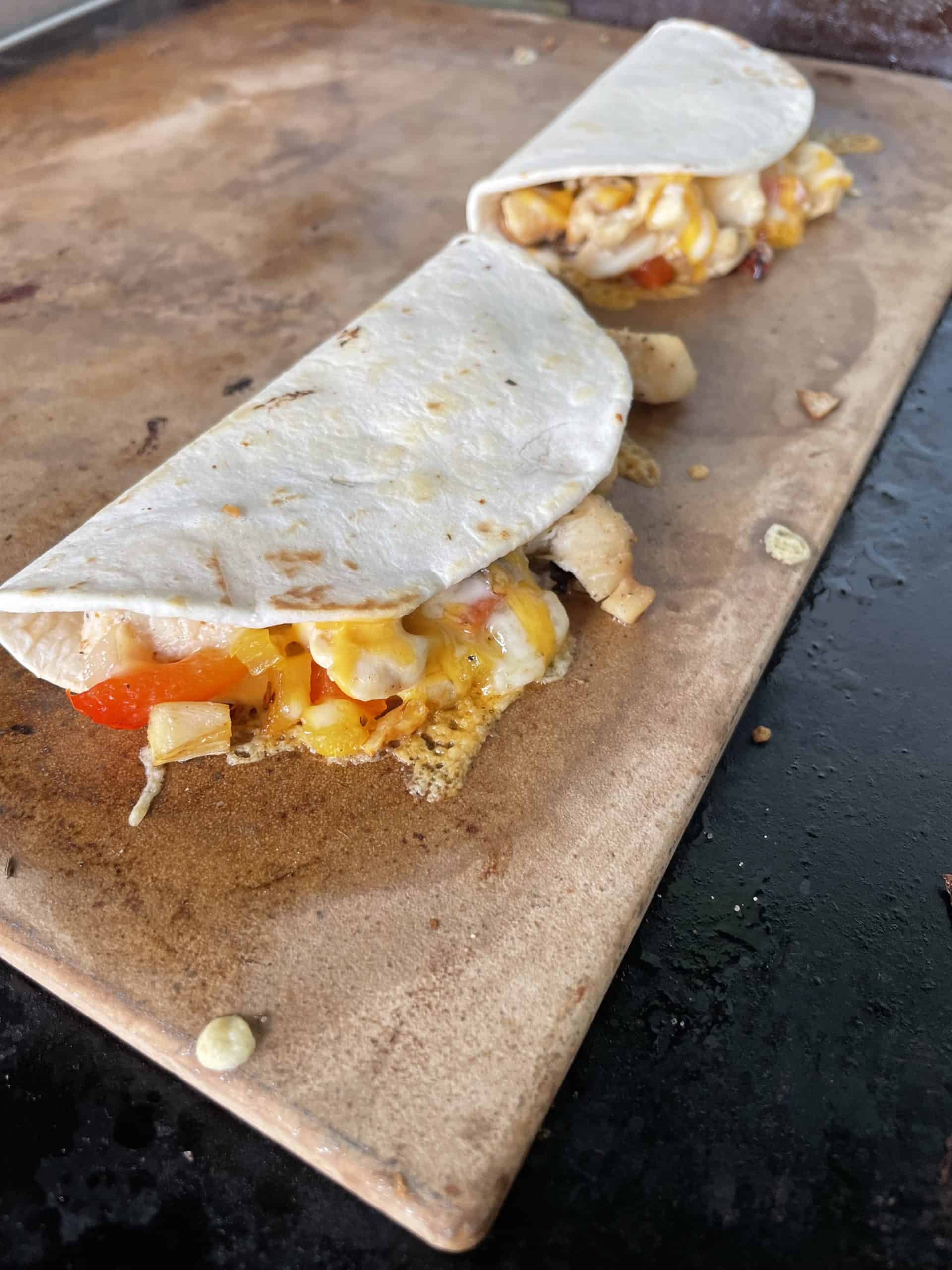 2 Full Chicken Cheese Quesadillas on a hot stone. 