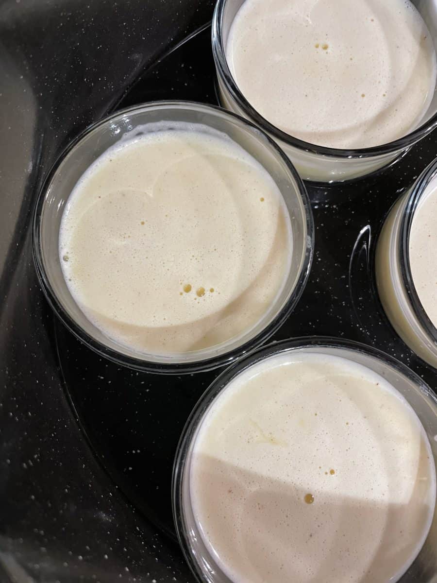 Custard mixture poured into the individual glass ramekins.