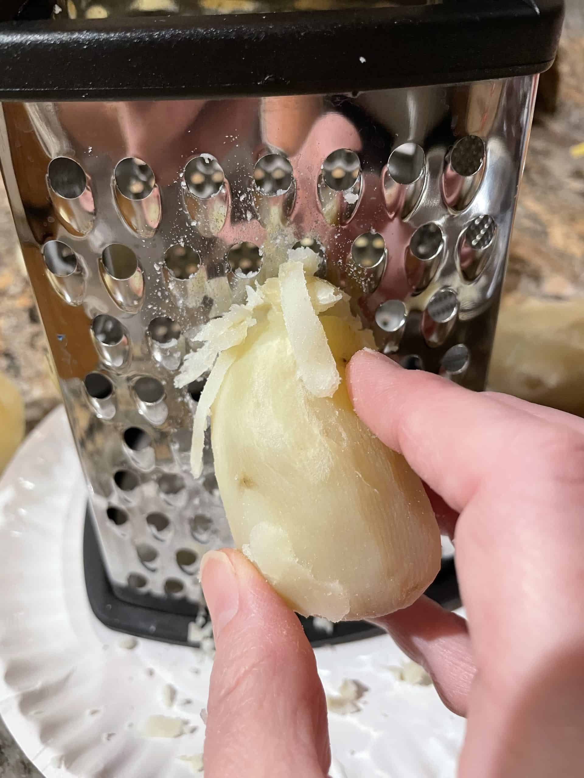 Shredding Peeled, Boiled Potatoes with a Box Grater.
