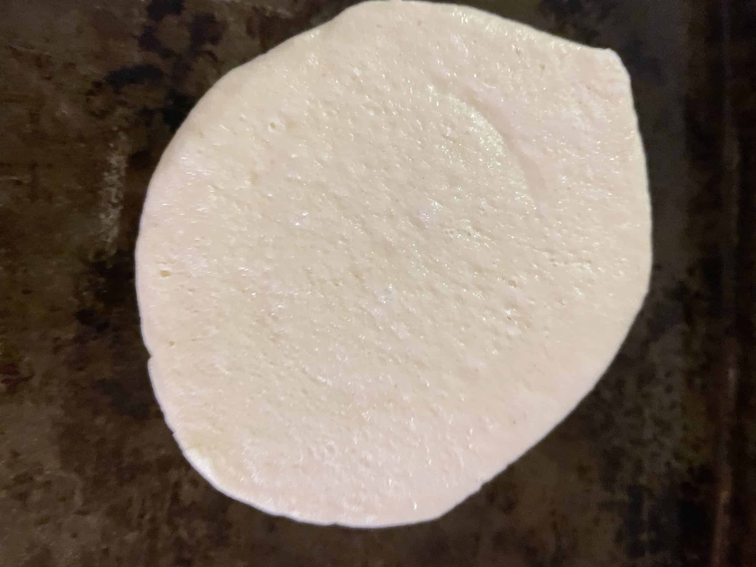 Pillsbury Mini Pizza Crust on a sheet pan.