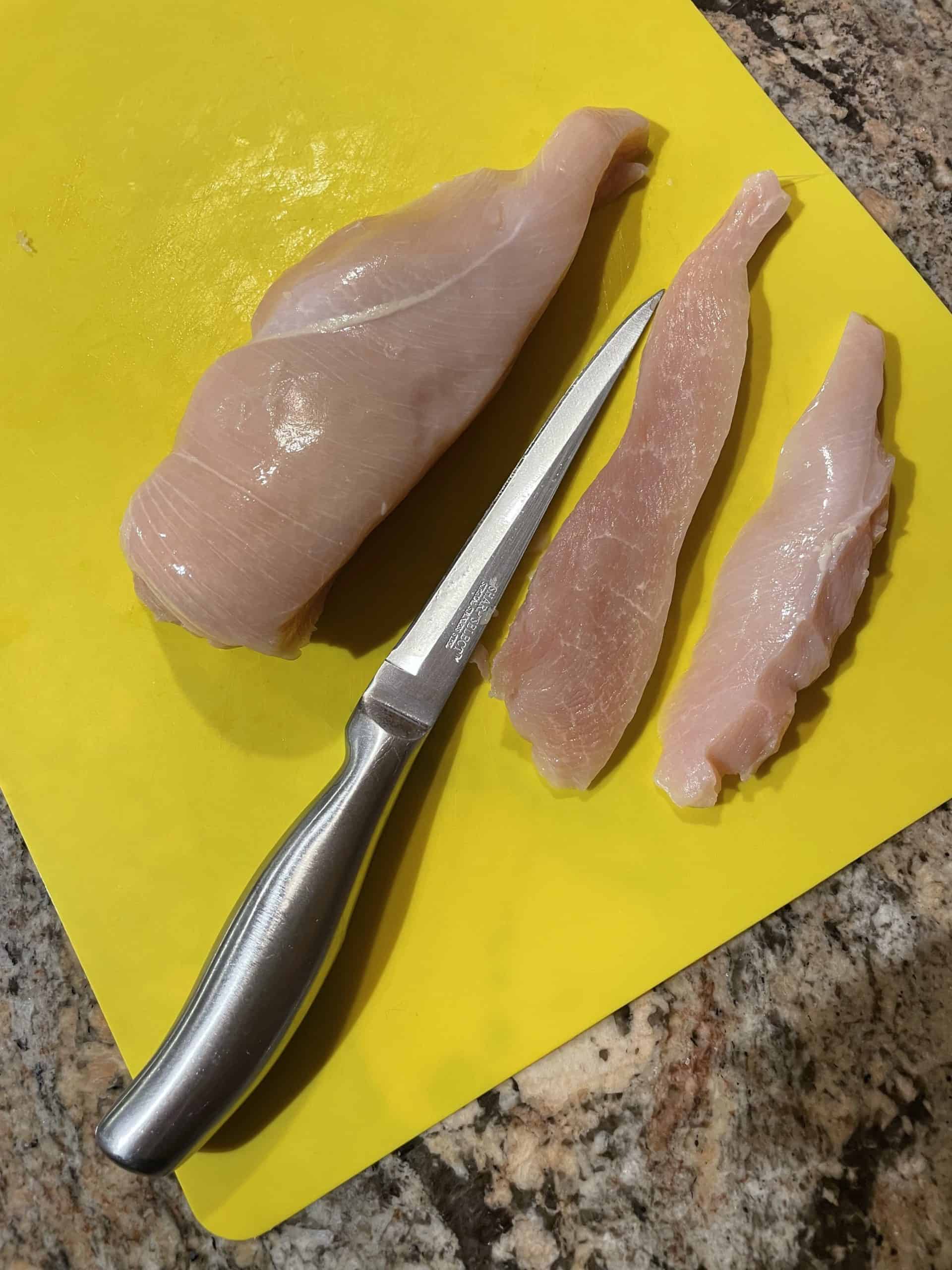 Chicken Breast cut into strips with a sharp knife.