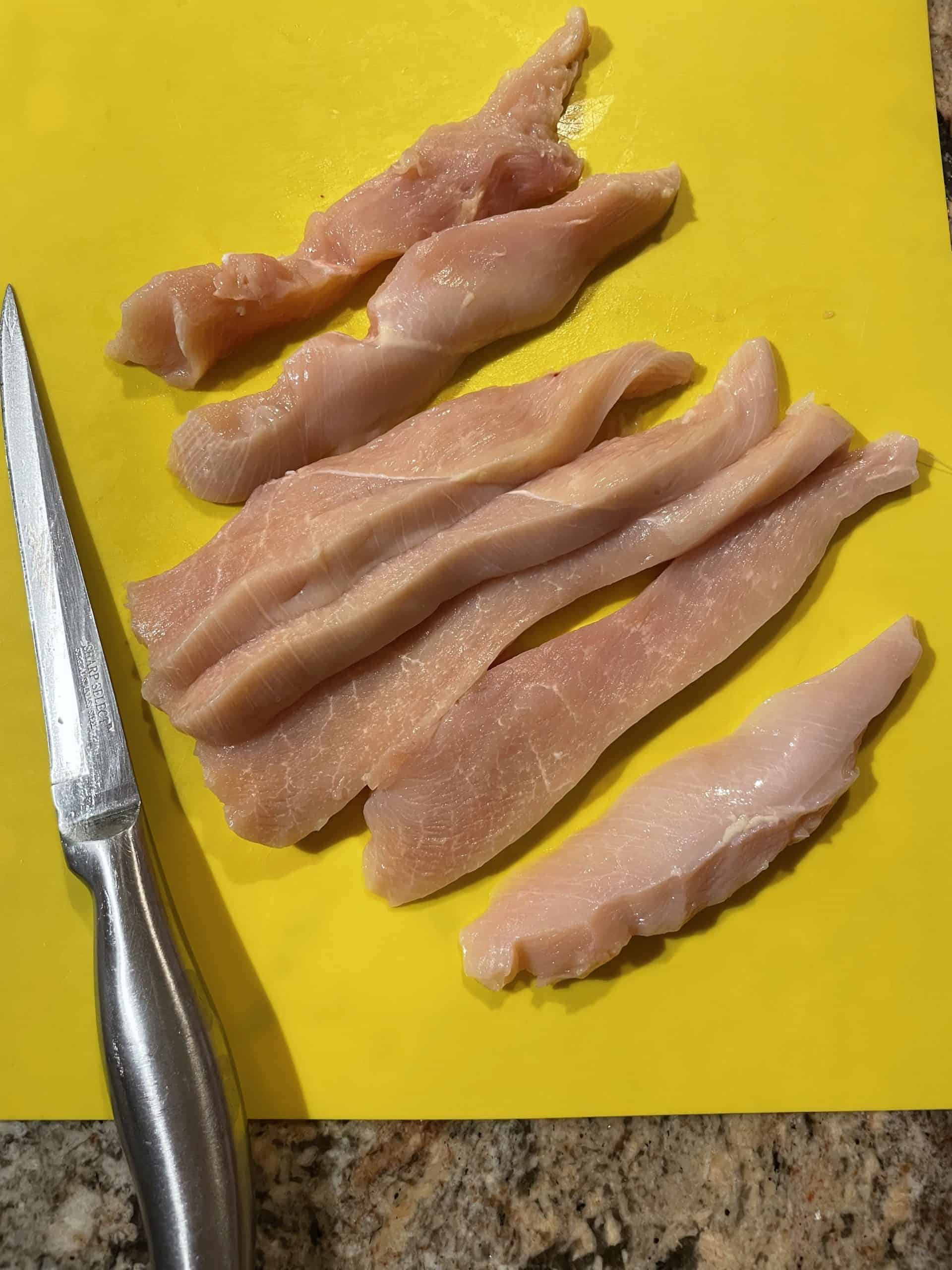 Chicken Strips that have been cut with a sharp knife.