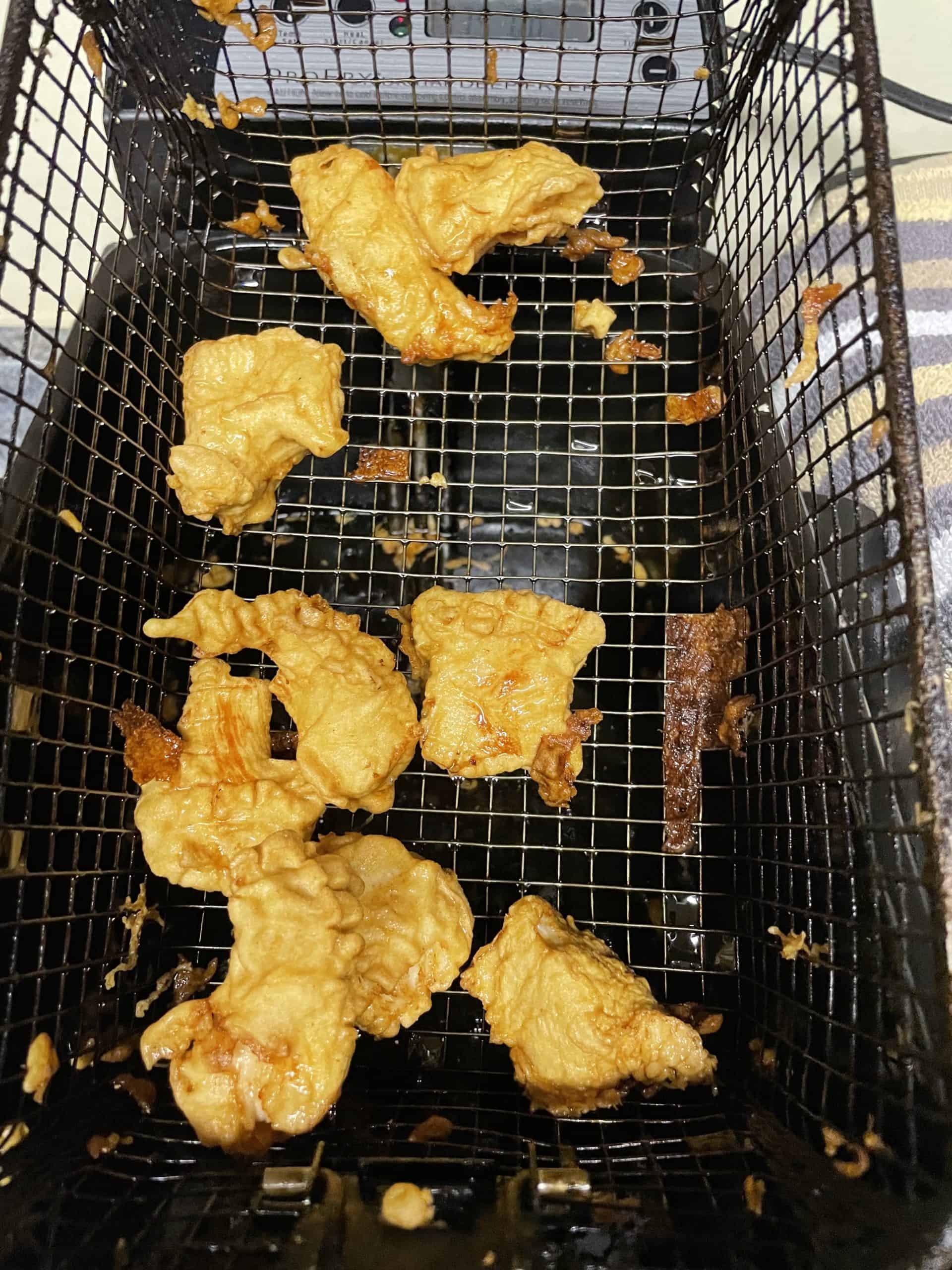 Deep Fryer Basket with fully cooked homemade chicken nuggets.