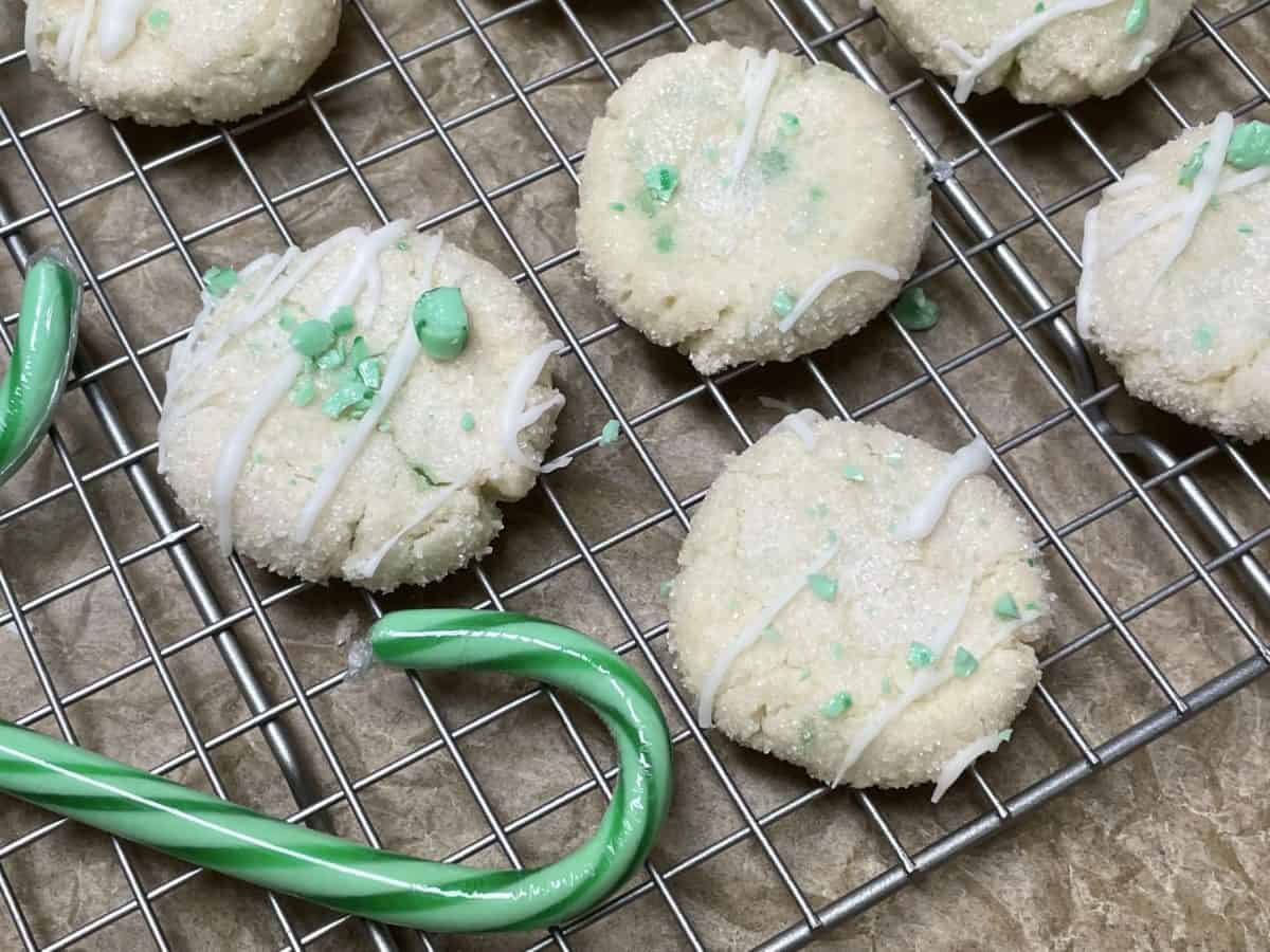 Crushed Candy Cane Cookie with Green Apple candy canes on a wire cooling rack.