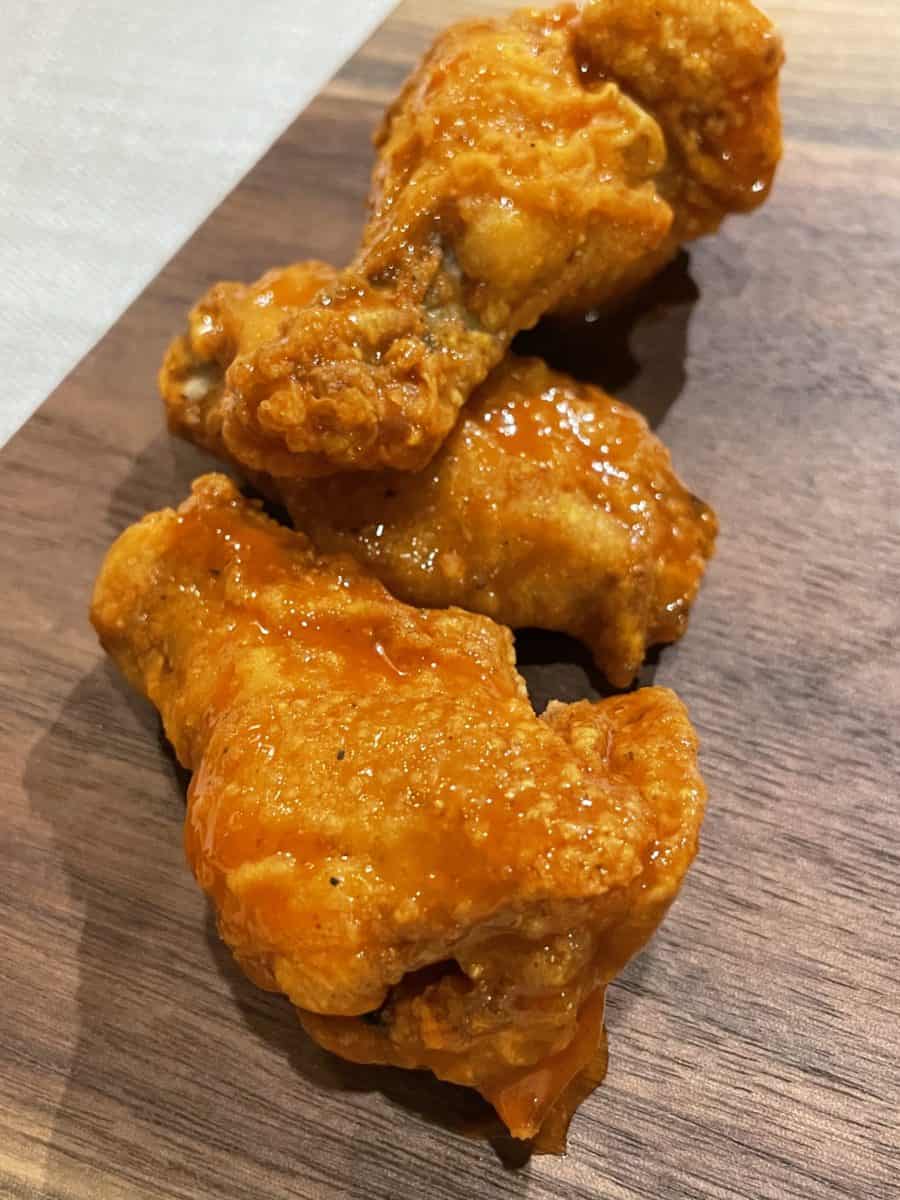 Traditional Wings with Buffalo Sauce a wooden board.