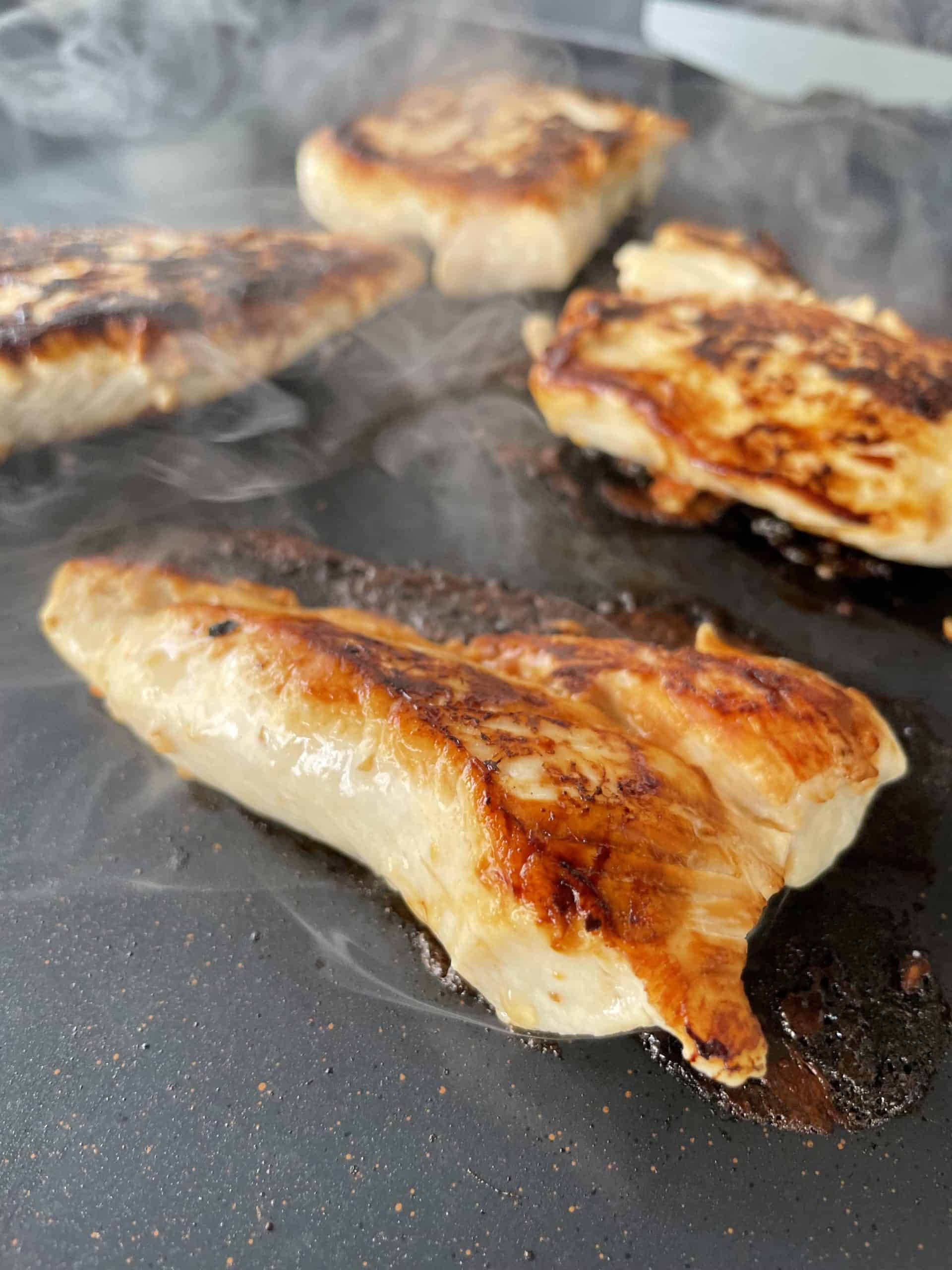 Cooked Chicken Breast pieces on a Blackstone Electric Griddle.