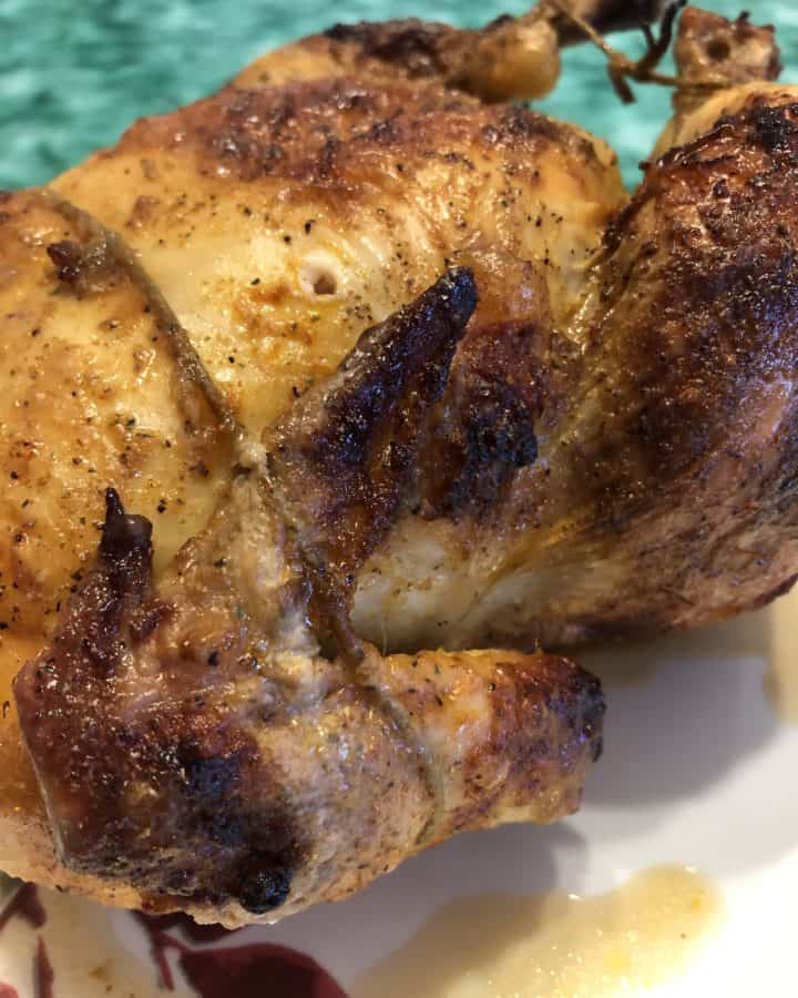 A Whole Chicken Cooked on a Rotisserie Oven.
