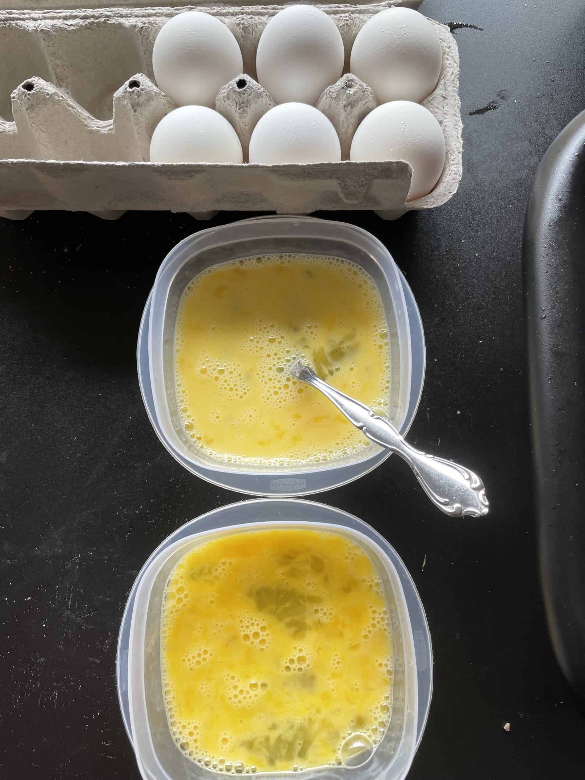 Whole eggs and two bowls of scrambled eggs.