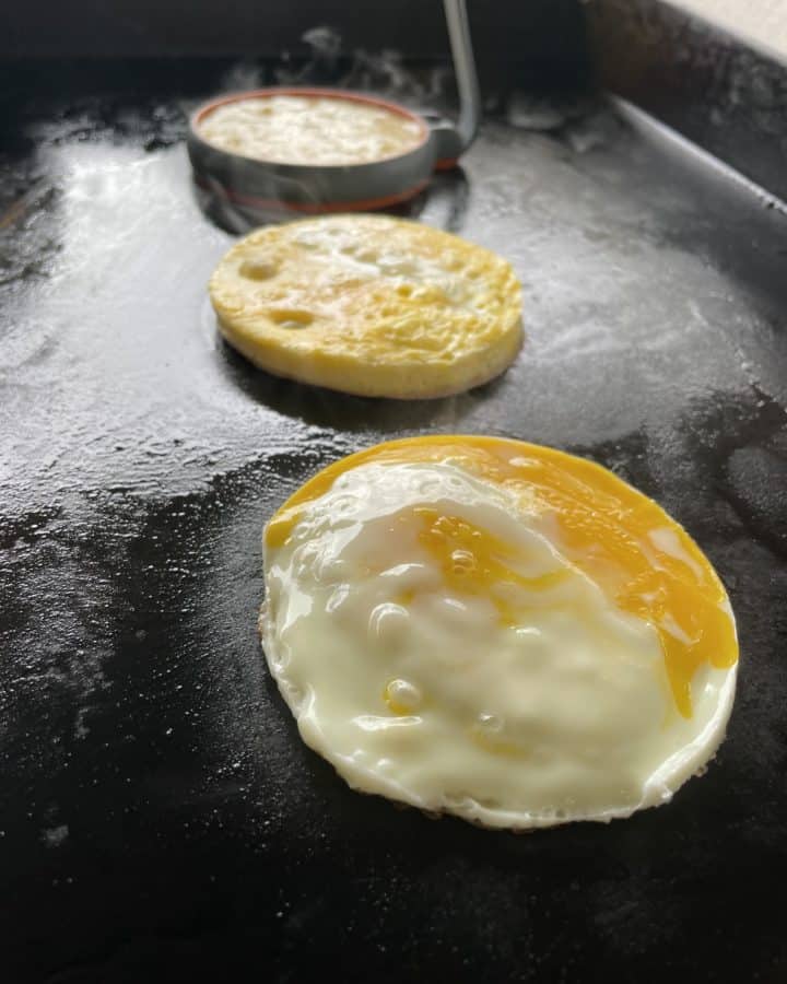 Egg patties cooking on a Flat Top Griddle.