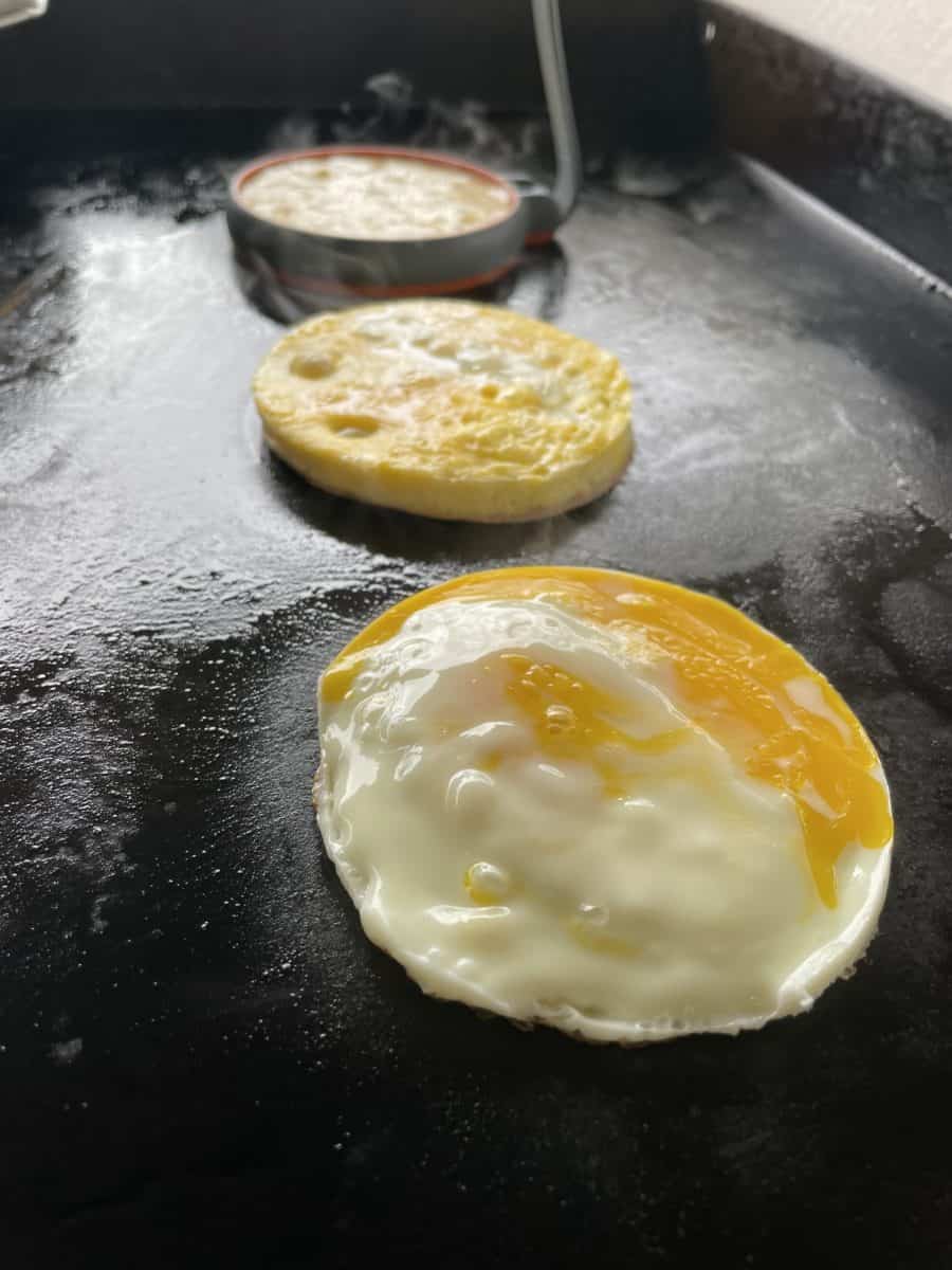 Egg patties cooking on a Flat Top Griddle.