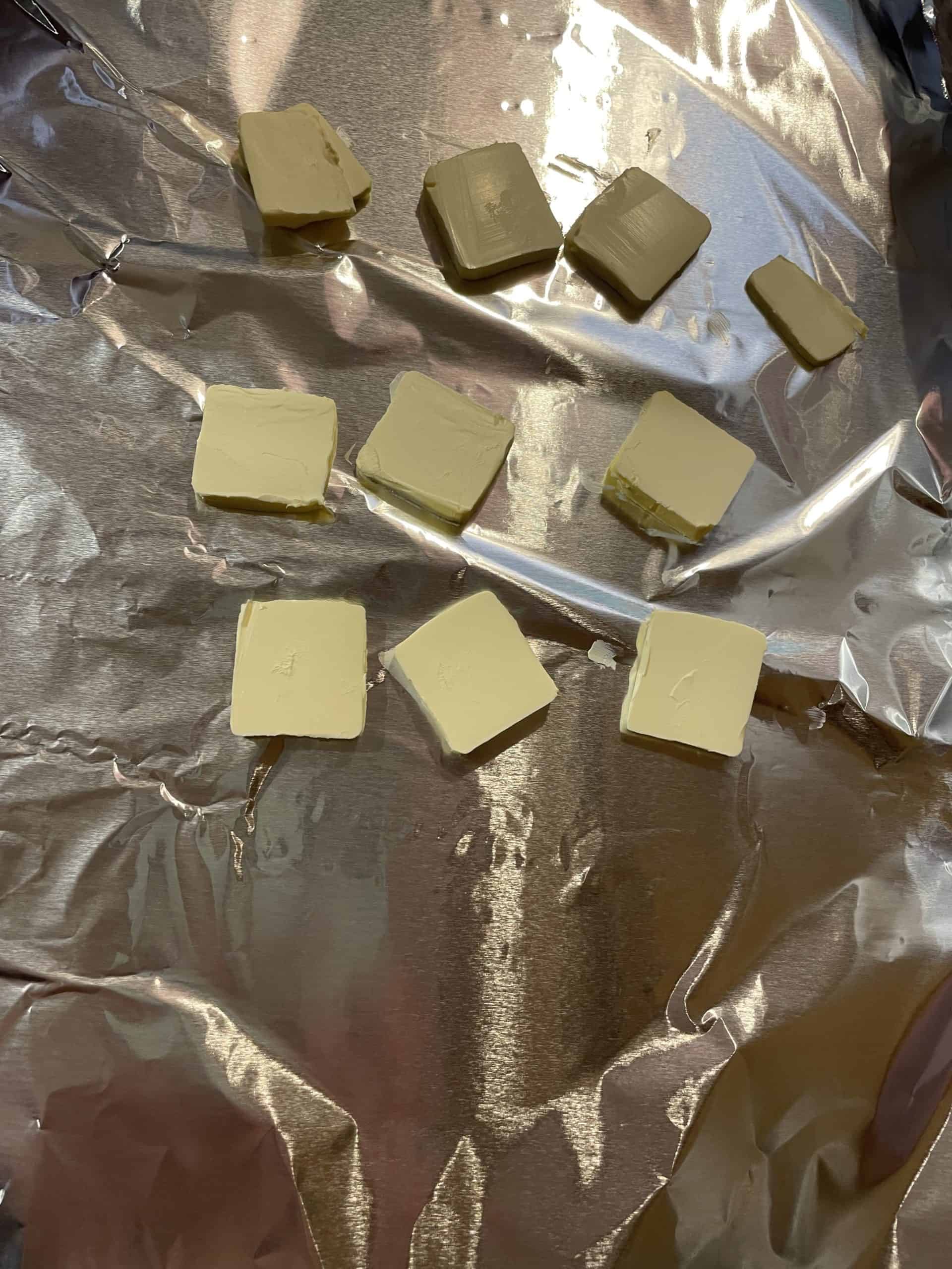 Butter/Margarine patties on a sheet of foil.