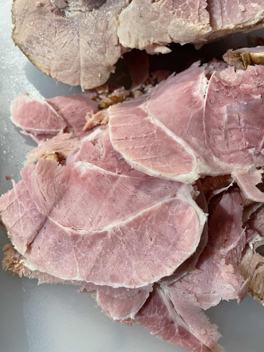 Easy Boil Ham - Sliced on a cutting board.