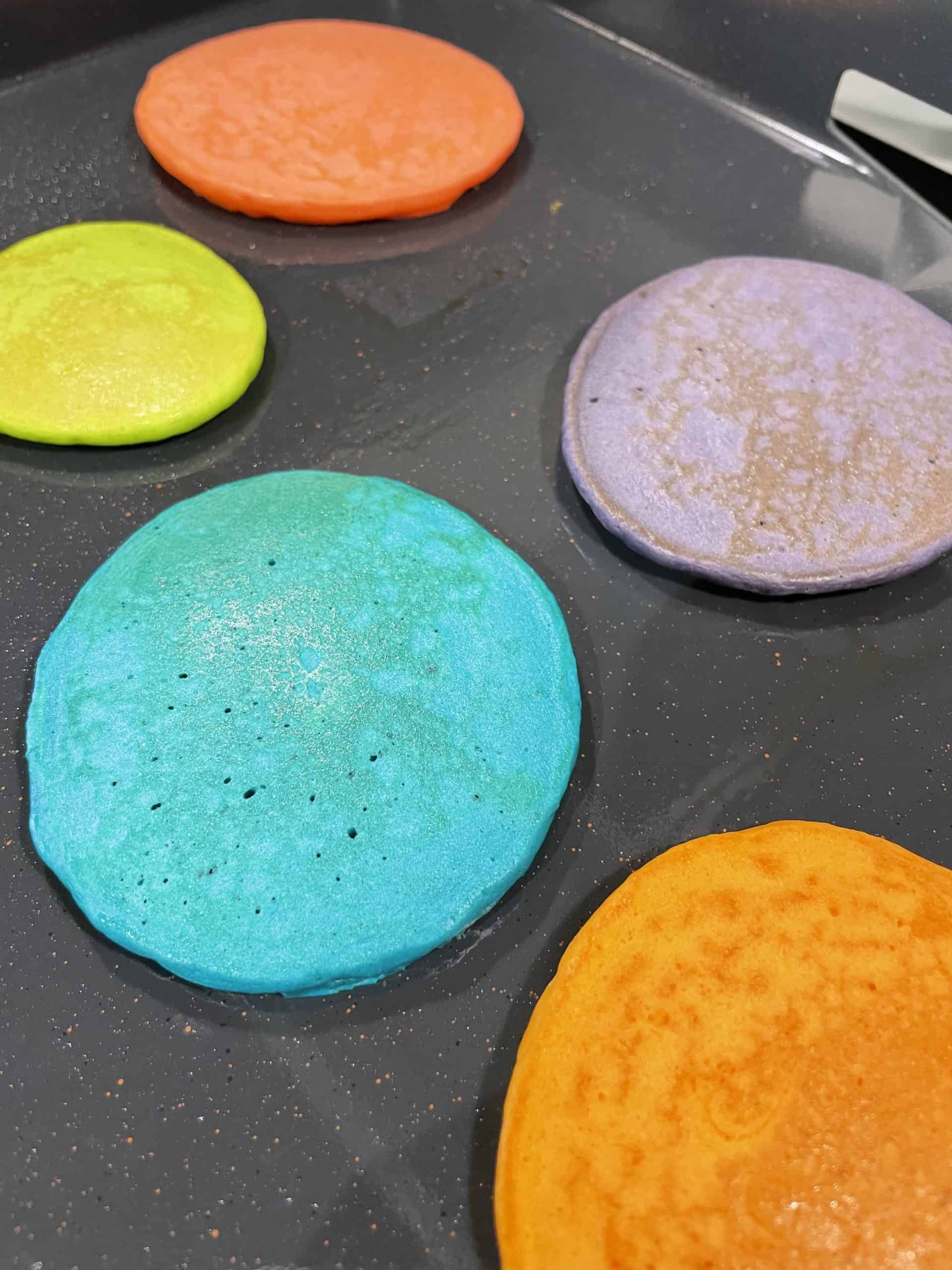 Colored Pancakes Cooking on a Blackstone Griddle.