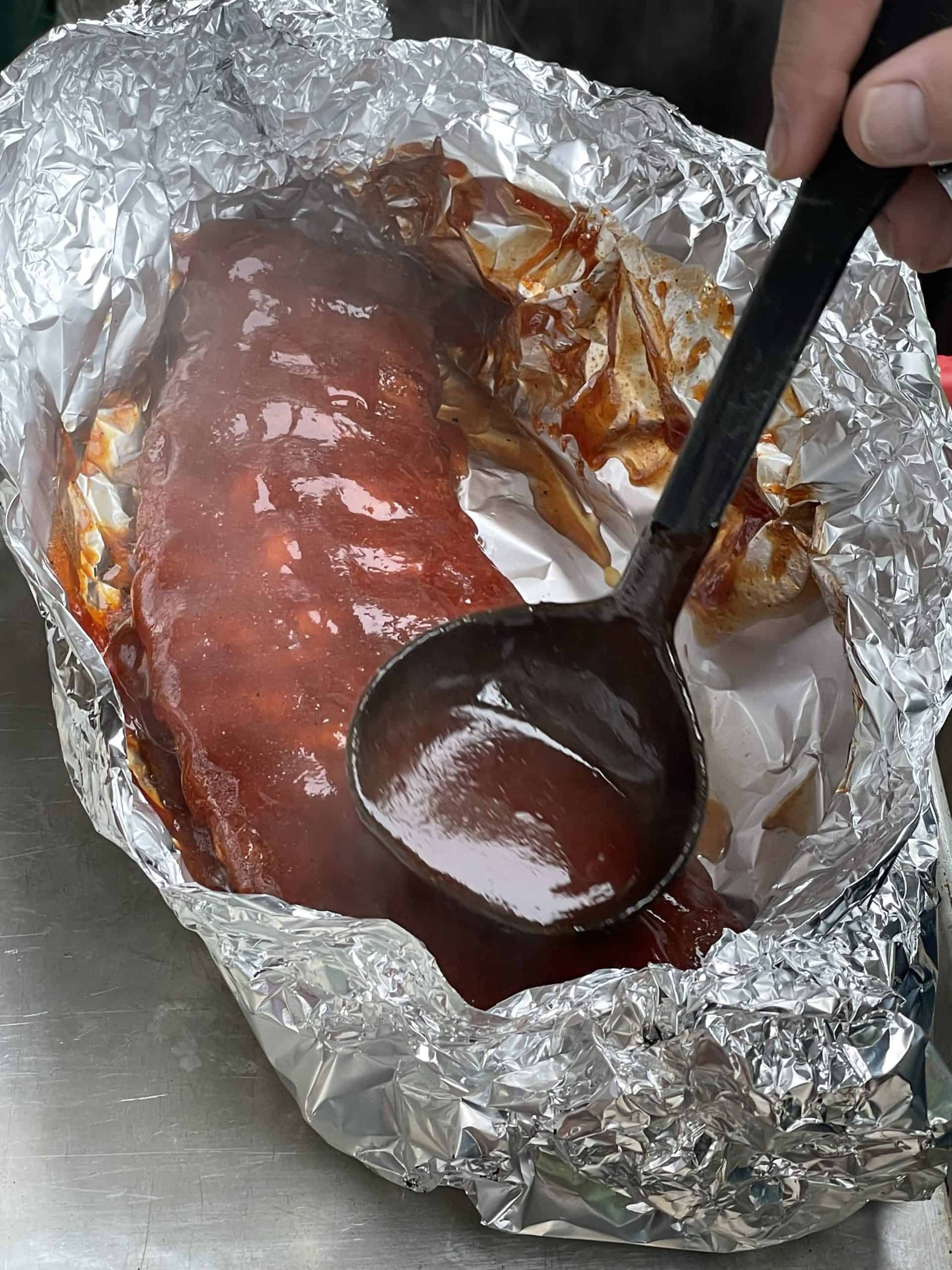 Smoker BBQ Sauce Ribs wrapped in foil.