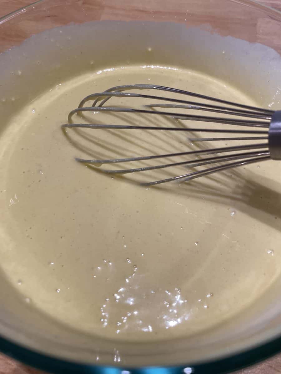 Pancake Batter in a Mixing Bowl with a whisk.
